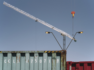 Two_Tower_Cranes_Shipping_Containers_Streetlight_at_Noon.jpg